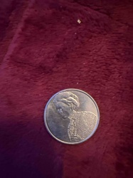 Commemorative Medal or Token featuring a figure in traditional attire