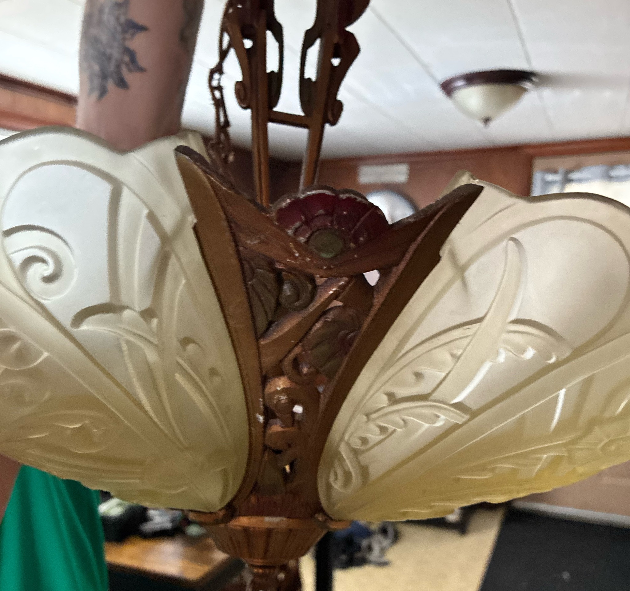 Submitted photo of Art Deco style hanging light fixture with frosted glass shades