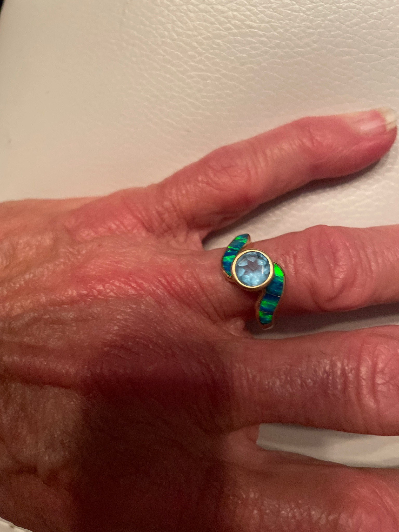 Submitted photo of Gold gemstone ring with opal and blue topaz
