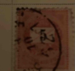 Perforated Postage Stamp with Numerical and Character Markings