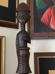 Carved Wooden Figure with Pipe and Textured Base