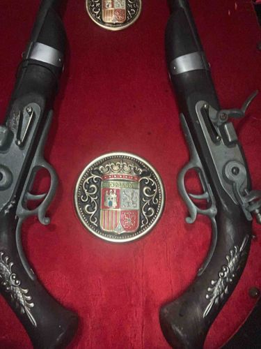 Pair of Decorative Spanish Flintlock Pistols with Coat of Arms Medallions