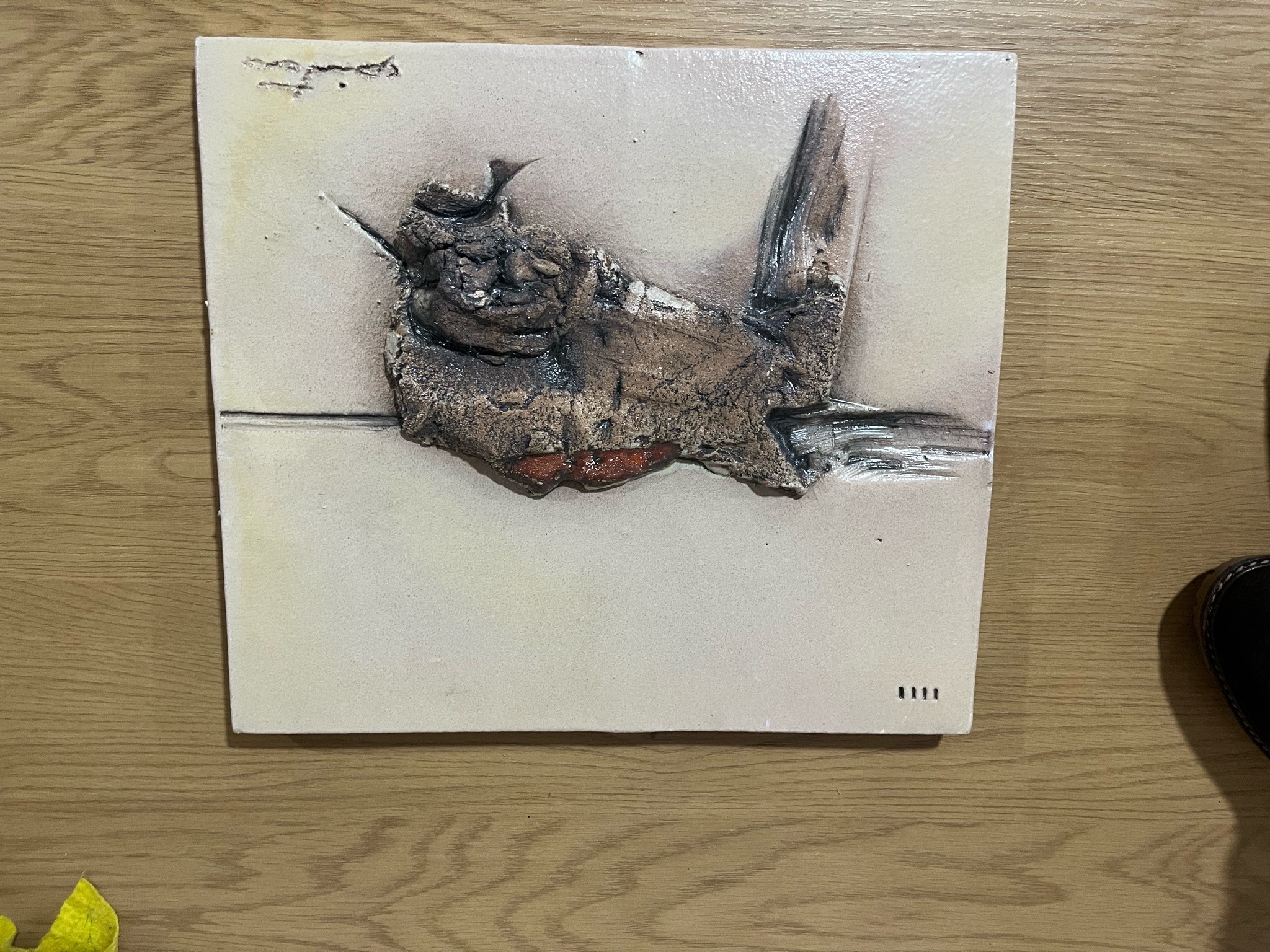 Submitted photo of Mixed media ceramic wall plaque with abstract sculptural element