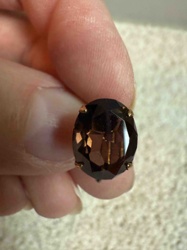 Oval Cut Brown Gemstone or Glass with Four-Prong Setting