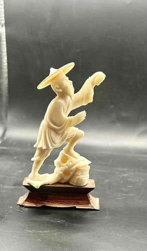 Carved Fisherman Figurine on Wooden Base