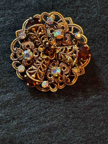 Vintage Filigree Brooch with Iridescent and Garnet-toned Rhinestones