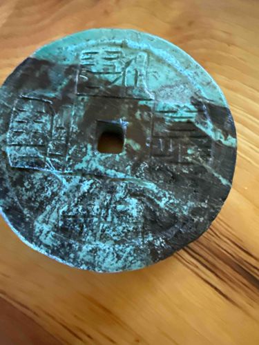 African Turquoise Disc with Central Square Cutout and Carved Symbols