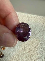 Large Oval-Cut Purple Stone (likely Amethyst or Purple Glass) in Prong Setting
