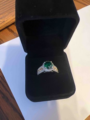 Oval Cut Emerald and Two-Tone Diamond Celtic-Style Halo Ring