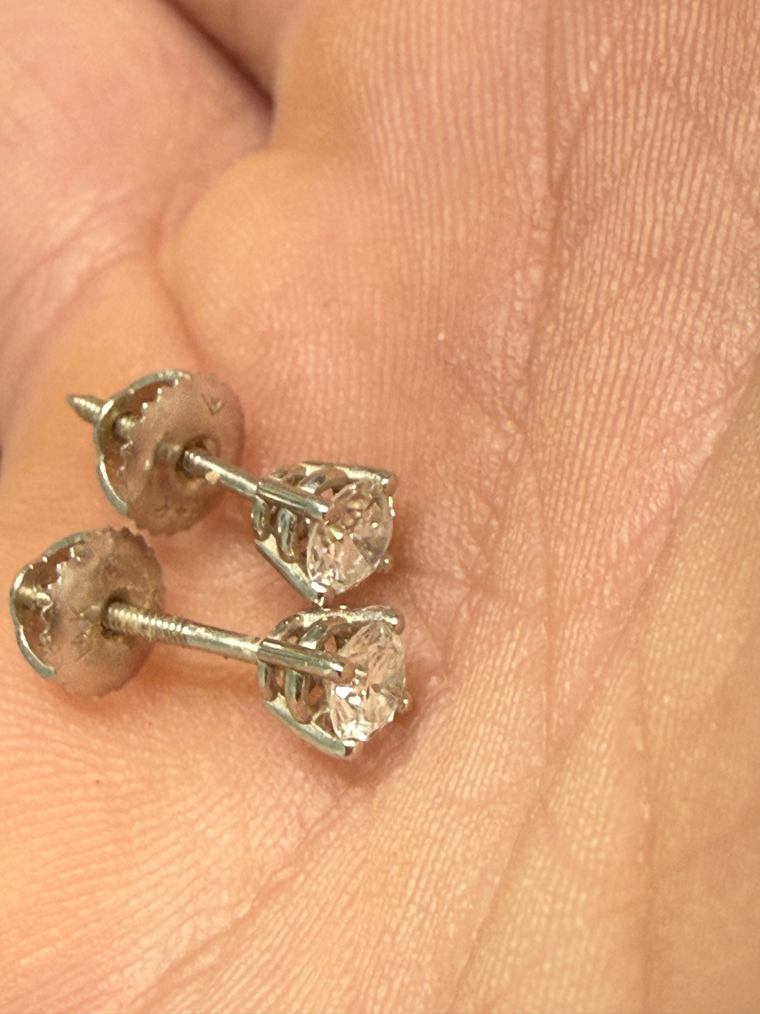Submitted photo of Diamond solitaire stud earrings (unauthenticated)
