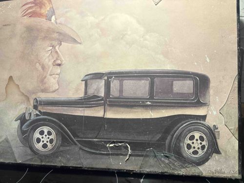 Vintage Depiction of a Man in a Hat and an Early Automobile