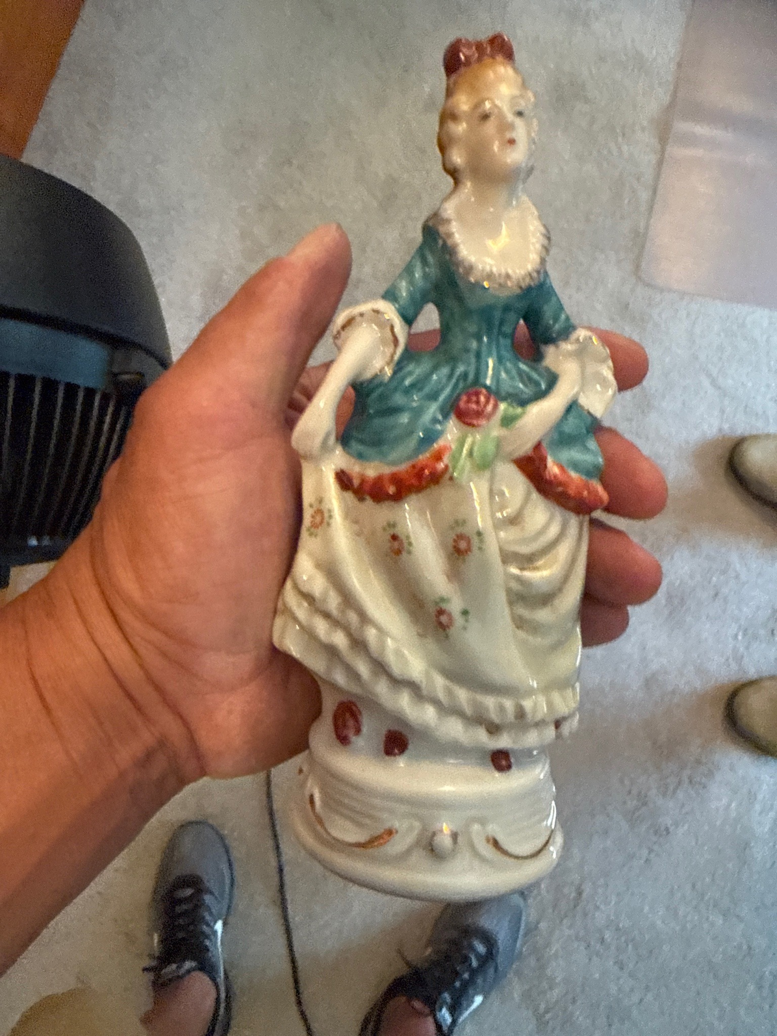 Submitted photo of Hand-painted porcelain figurine of a woman in period attire