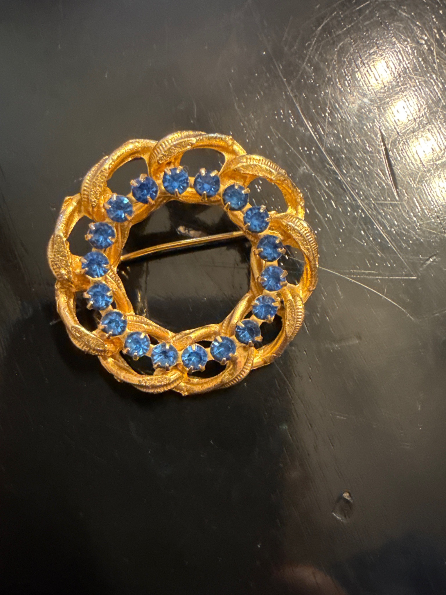 Submitted photo of Gold-tone rhinestone wreath brooch