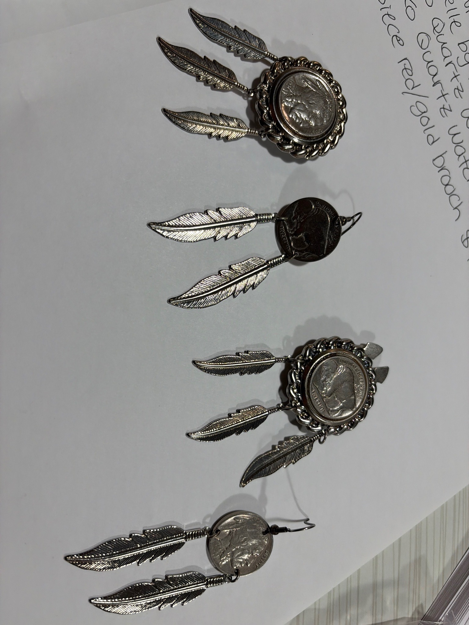 Submitted photo of Coin and feather drop jewelry group (unauthenticated)