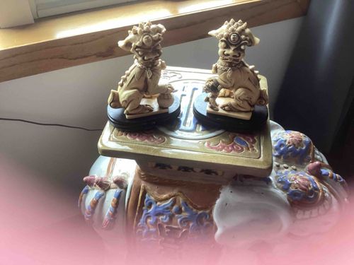 Pair of Foo Dog Statuettes on Pedestals