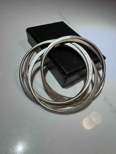 Set of Four Silver-Toned Bangle Bracelets