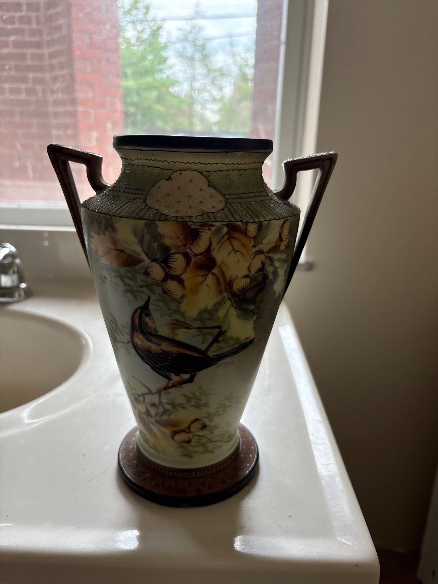 Submitted photo of Hand-painted ceramic handled vase