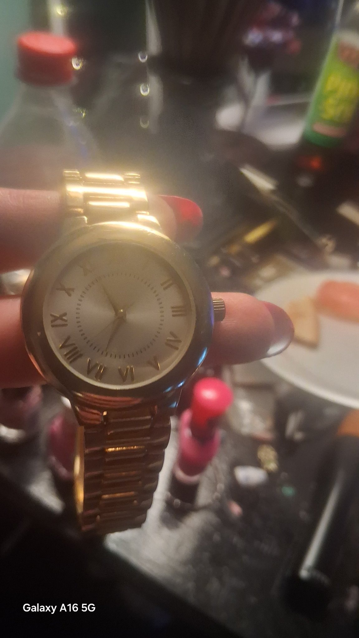 Submitted photo of Gold-toned wrist watch with Roman numerals