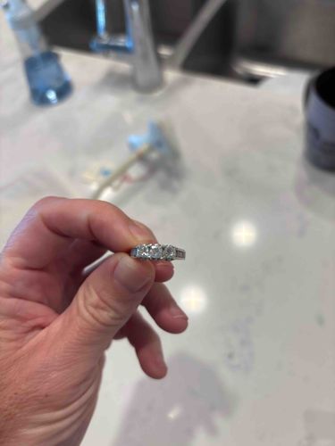 Three-Stone Diamond Ring with Channel-Set Accents