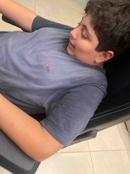 Boy in a T-shirt and Seated Chair