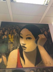 Woman with a Cell Phone in a Crowd
