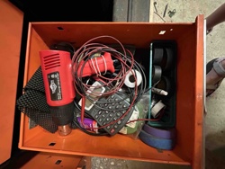 Assorted Tools and Electronic Components in an Orange Toolbox Drawer