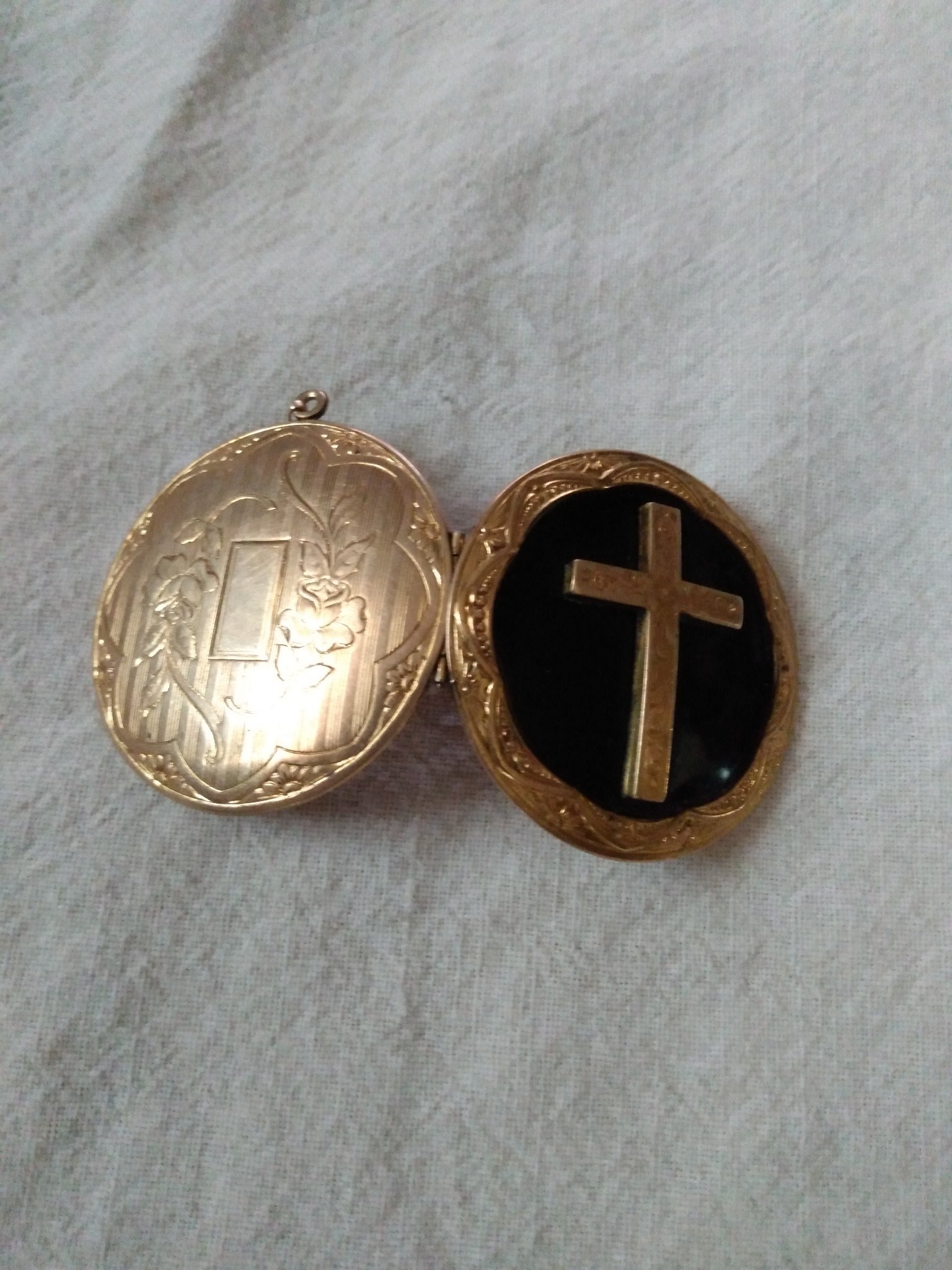 Submitted photo of Gold-filled locket pendant with cross motif