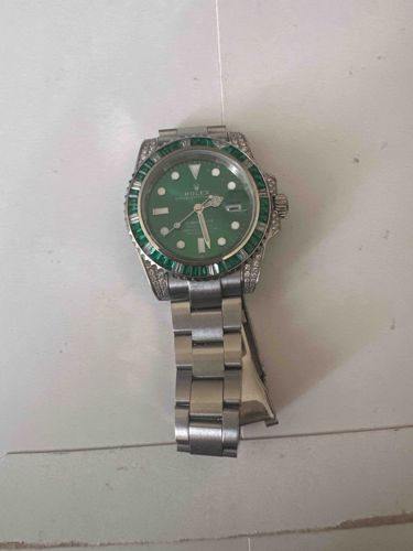 Rolex Watch with Emeralds and Diamonds