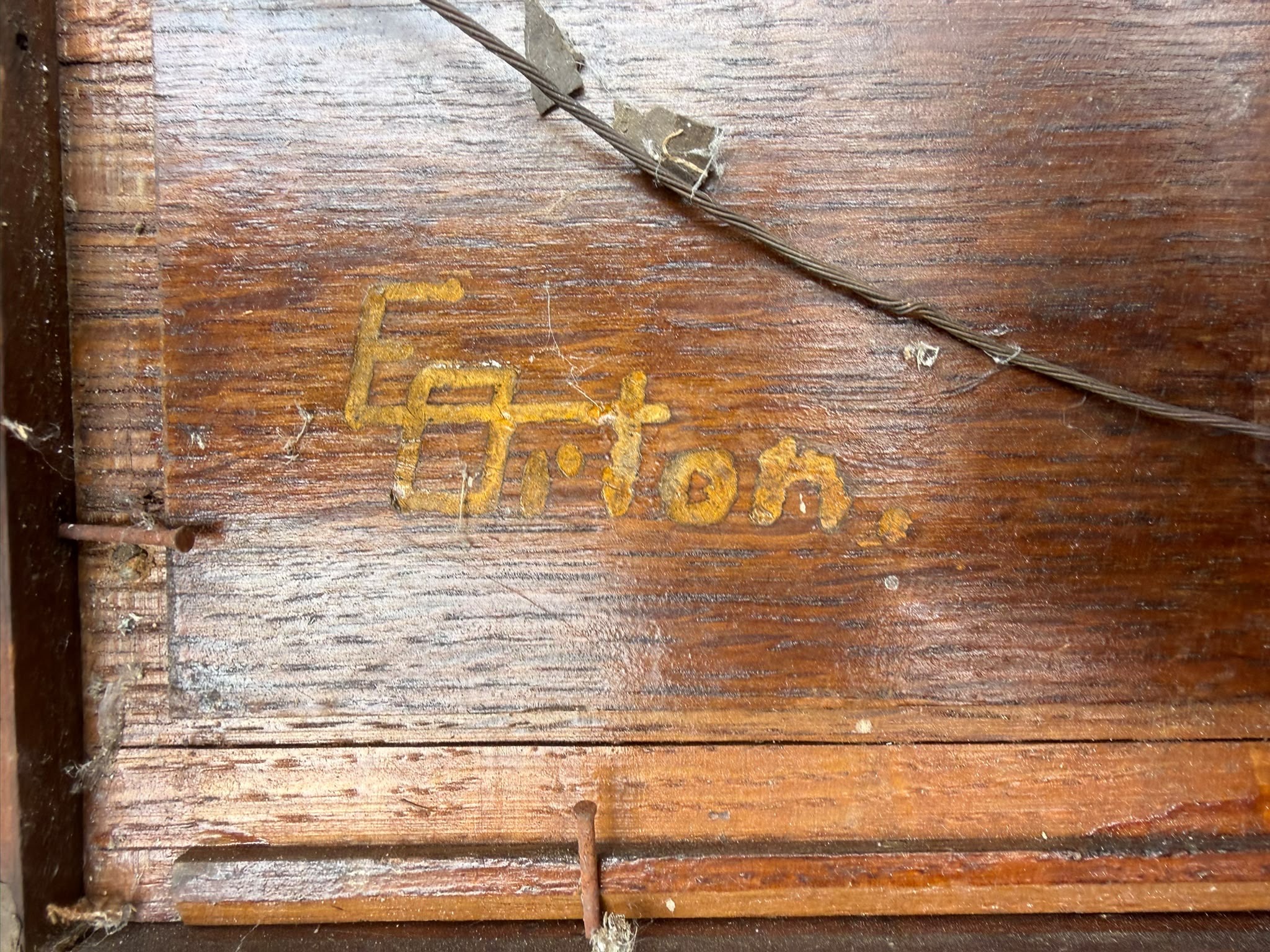 Submitted photo of Wood panel bearing a stamp reading 'Egerton'