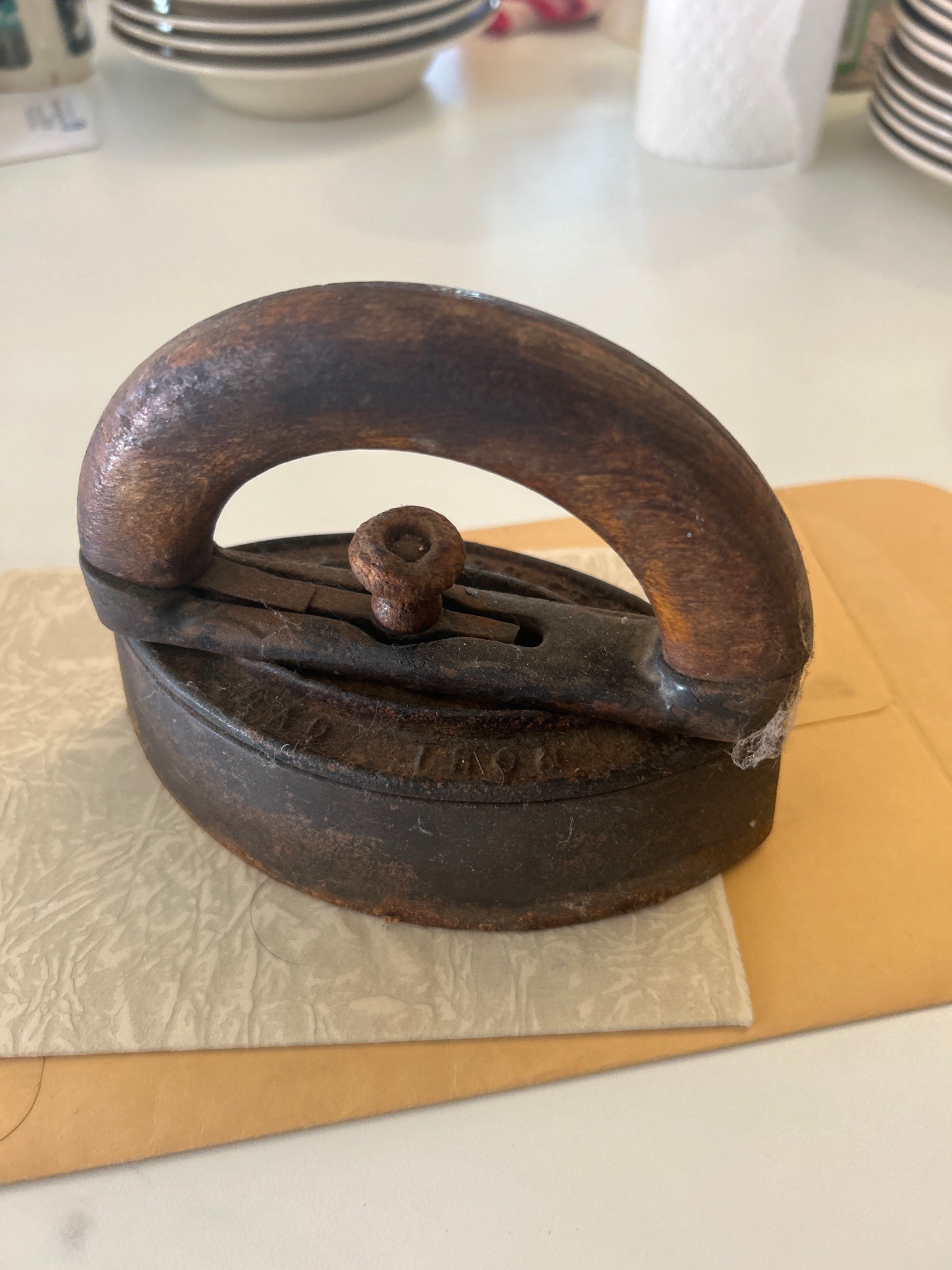 Submitted photo of Cast iron sad iron with wooden handle
