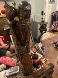 Carved Wooden Figure of a Man Carrying a Vessel (Water Carrier)