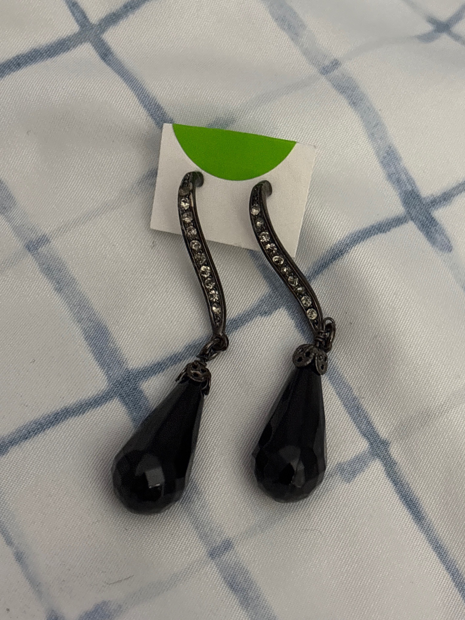 Submitted photo of pair of drop earrings with black teardrop beads and pavé-set crystals