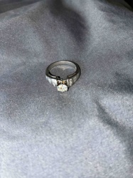 Diamond Solitaire Engagement Ring with Channel-Set Accents