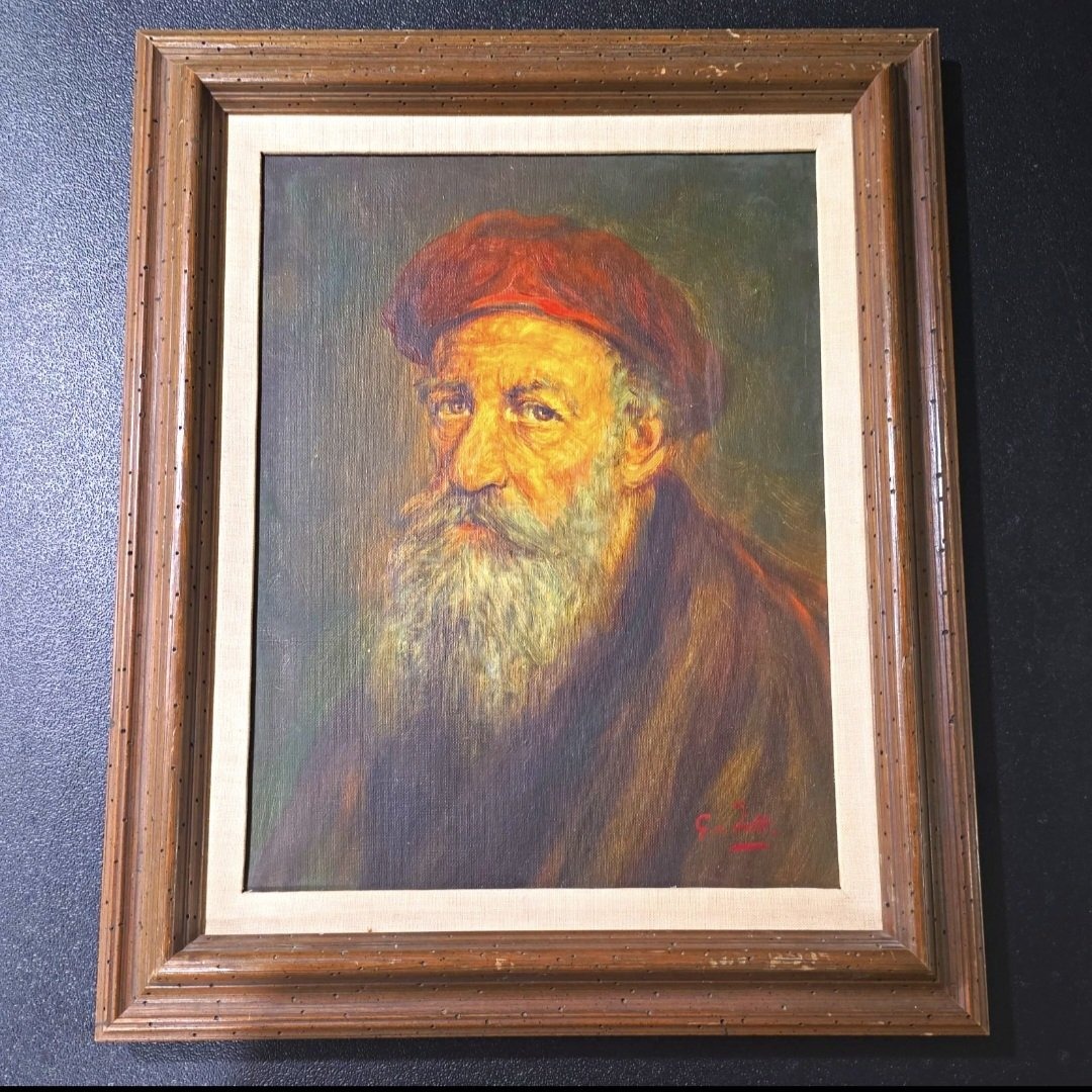 Submitted photo of Oil portrait signed 'G. Induno'