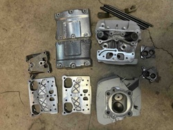 Disassembled Motorcycle Engine Components (Cylinder Heads and Covers)