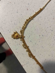 Traditional Indian Gold Necklace with Beadwork and Central Stone