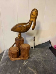 Carved Wooden Pelican Figurine on Pier Pilings Base