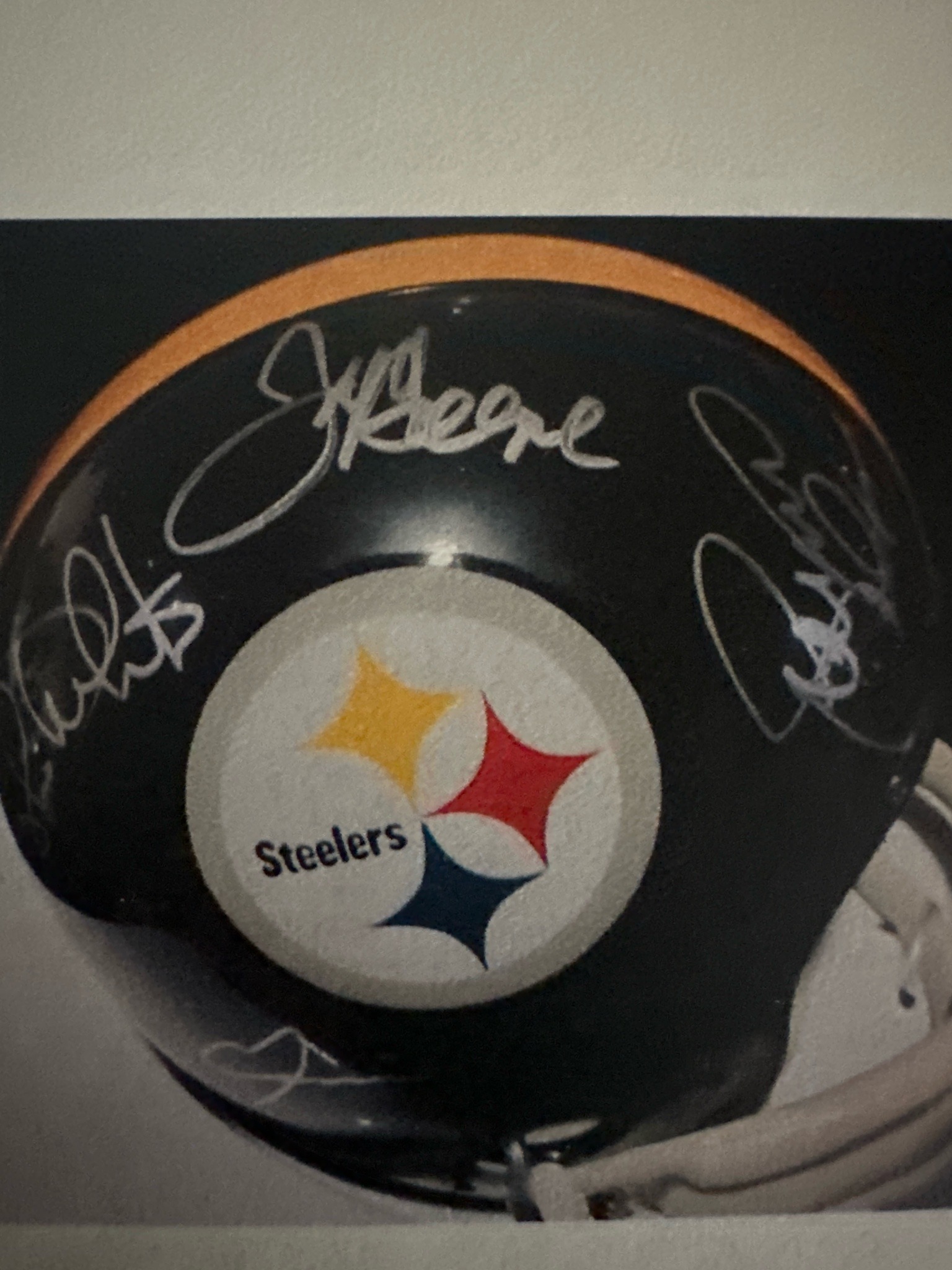 Submitted photo of Football helmet replica bearing multiple signatures