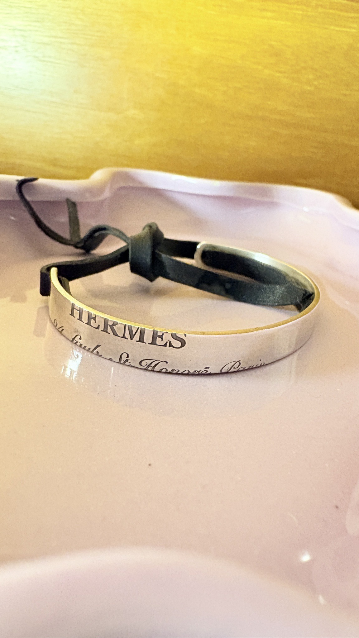 Submitted photo of Hermès metal and leather bracelet (not authenticated)