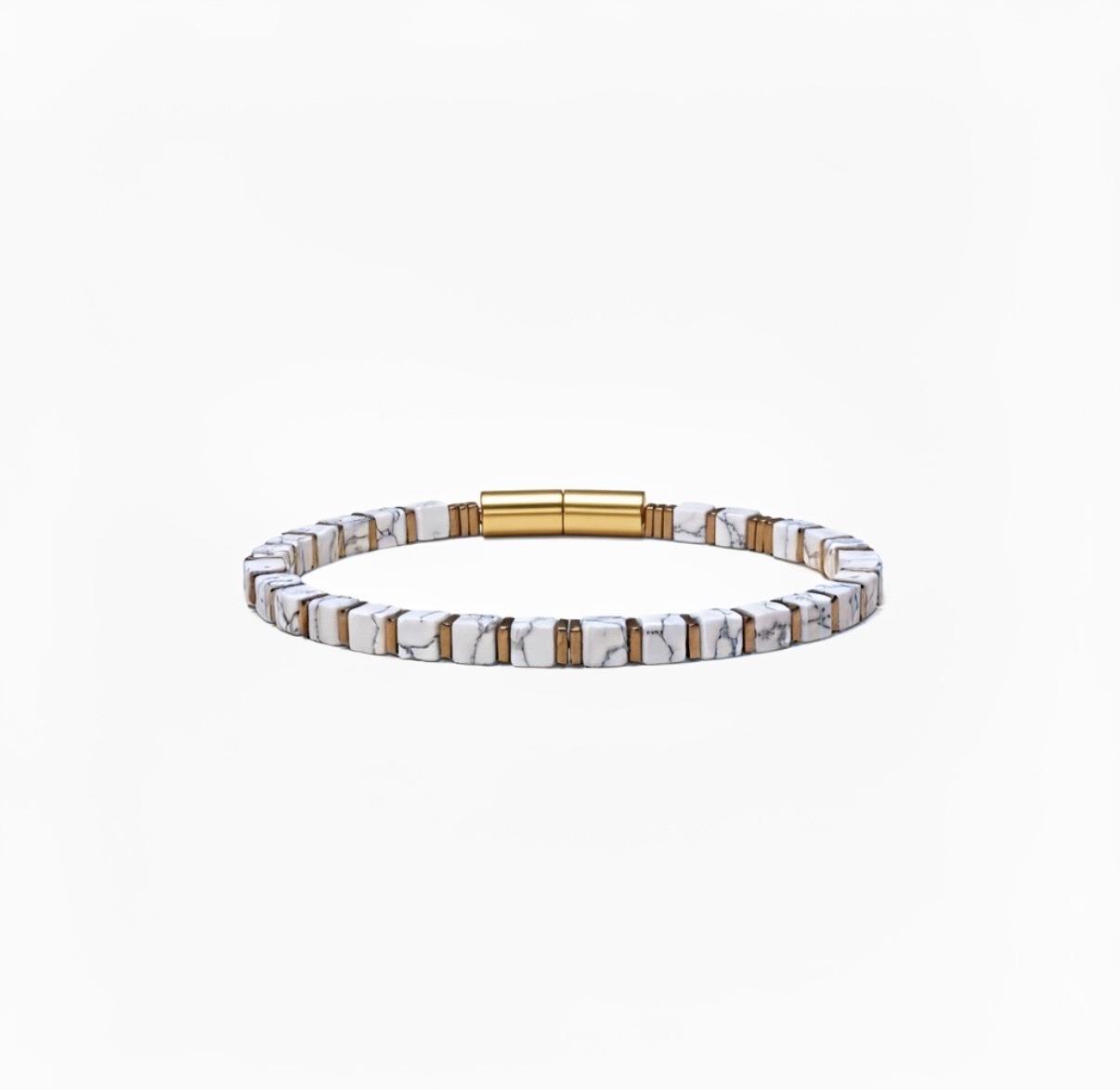 Submitted photo of Beaded bracelet with white marble-patterned and gold-toned spacers