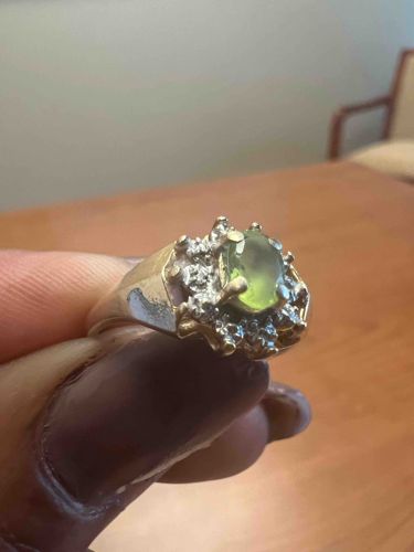 Gold Toned Ring with Green Gemstone and Diamond Accents
