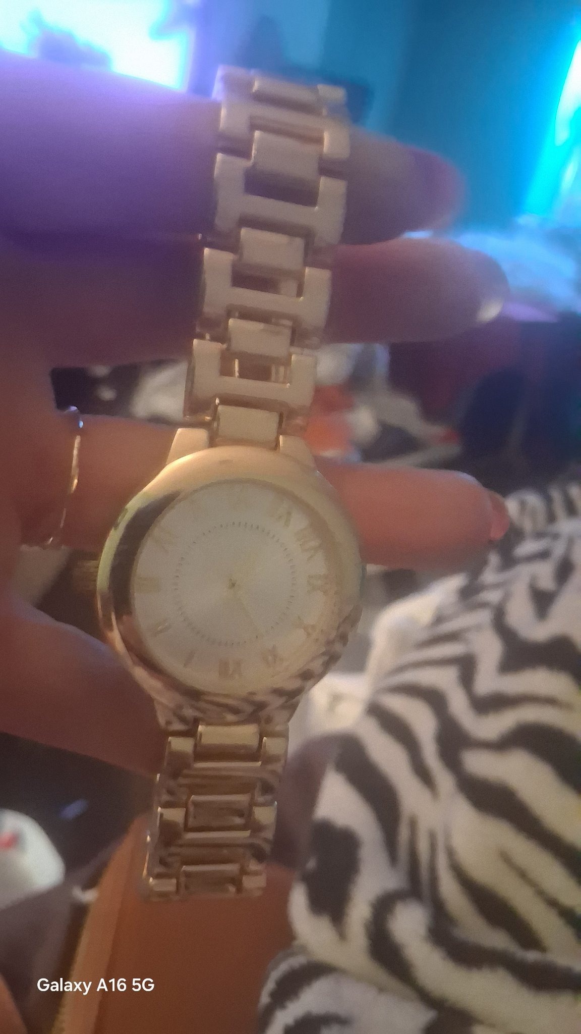 Submitted photo of Gold-tone analog wristwatch with Roman numerals