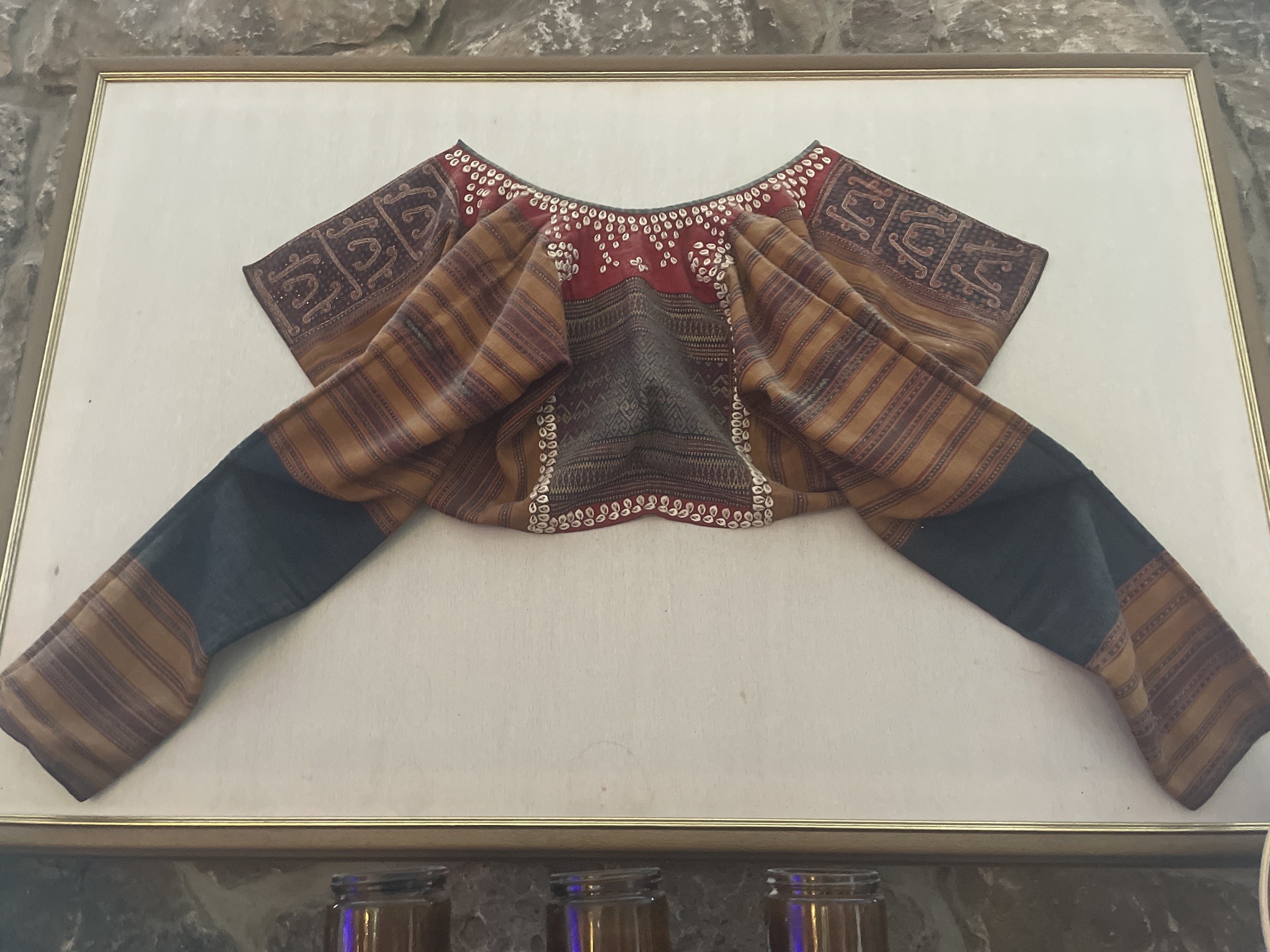Submitted photo of Traditional textile garment mounted in a frame