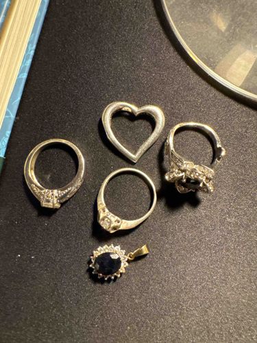 Collection of Assorted Silver-Tone Rings and Pendants