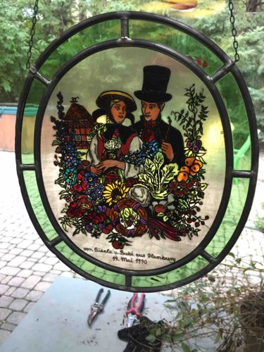 Stained Glass Suncatcher with Traditional German Couple Scene