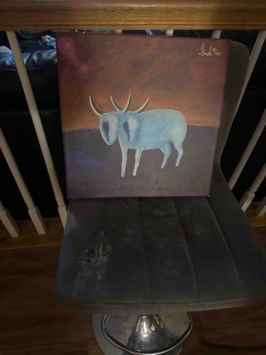Painting of a Horned Animal with Dark Background