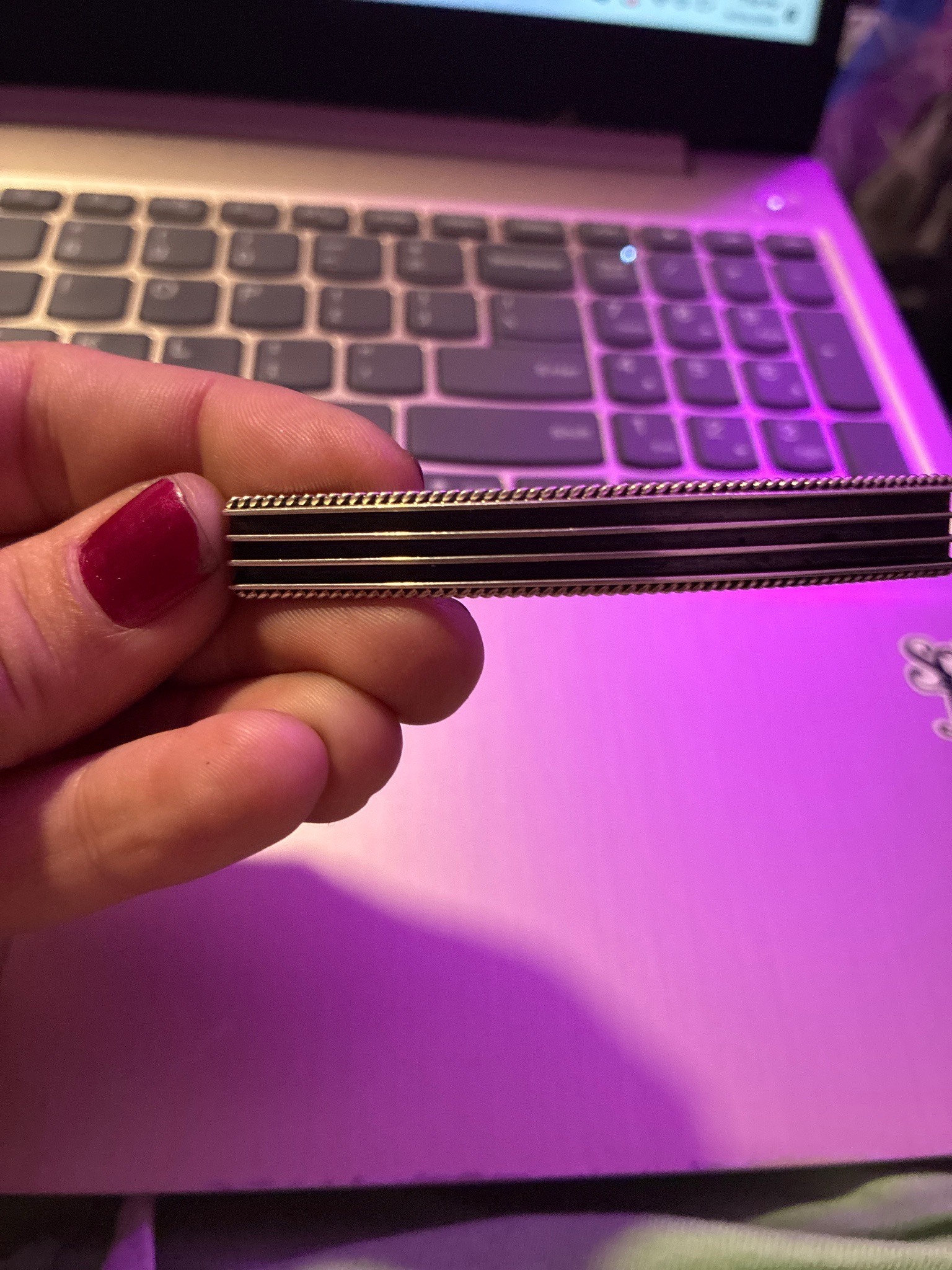 Submitted photo of Gold and Enamel Tie Bar