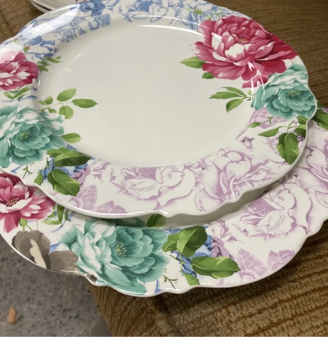 Submitted photo of Floral ceramic dinner plates, attributed to Scarlett Ceramics Los Angeles