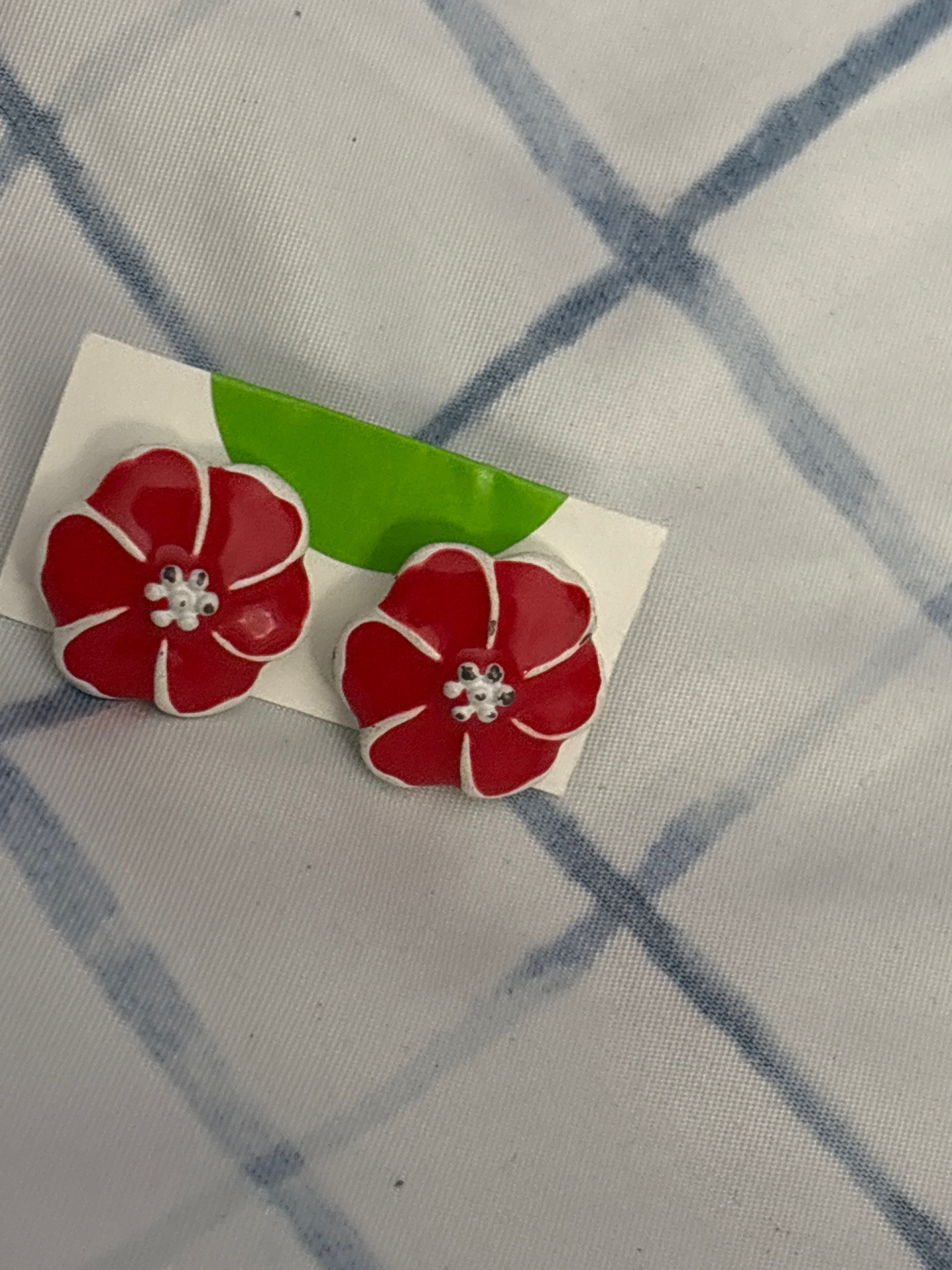 Submitted photo of Pair of red and white floral costume earrings