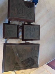 A set of three Chinese Export lacquered wood nesting tables and one larger rectangular lacquered panel or table top